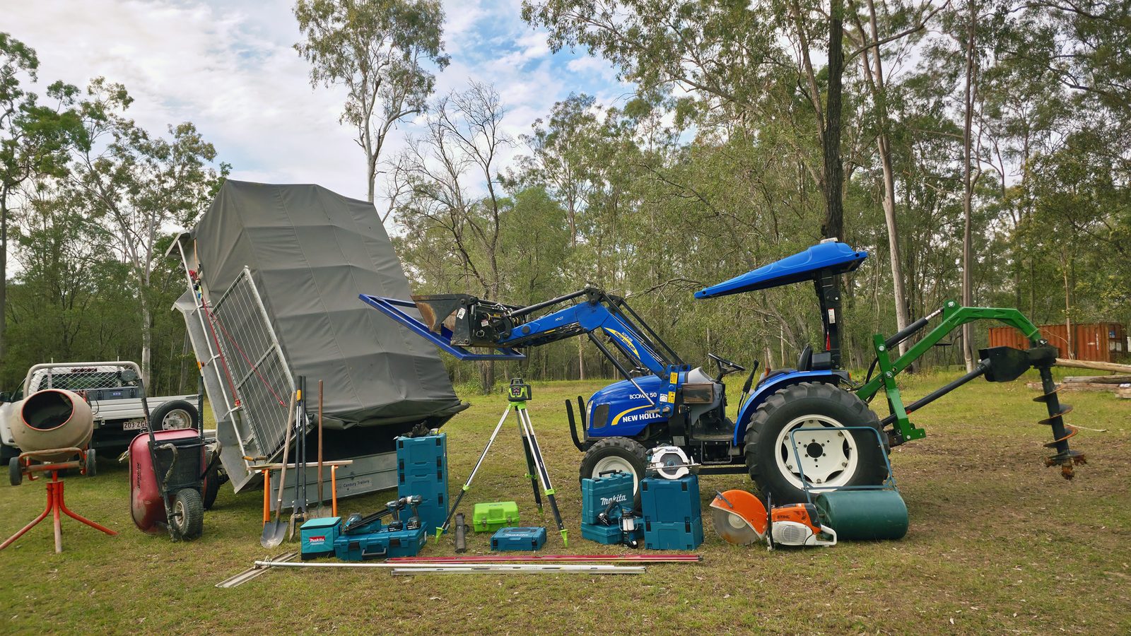 Holly Civil's New Holland tractor and post-hole auger set up on a job site near Jimboomba